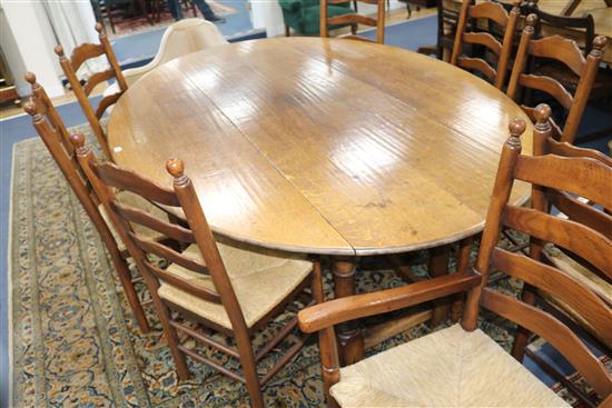 A 17th century style oak double gateleg table W.210cm.